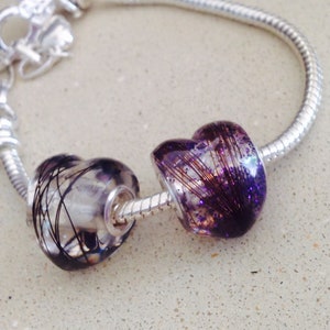 Heart shaped memorial resin bead with hair or ashes