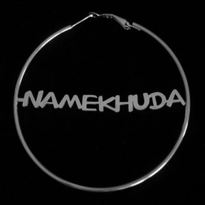 May include: Silver hoop earrings with the name "NAMEKHUDA" spelled out in bold letters.