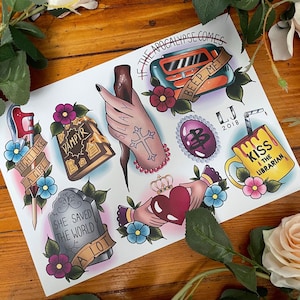 May include: A set of nine colourful tattoo flash designs featuring various pop culture references. The designs include a book titled "Vampyr", a stake, a heart, a crown, a mug with the text "Kiss the Librarian", a gem with the letter "B", a radio with the text "Beep Me!" and a sword with the text "Fight Like a Girl".