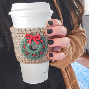 The crochet mini Christmas wreath cozy.