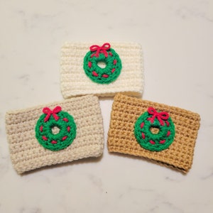 The crochet mini Christmas wreath cozy.