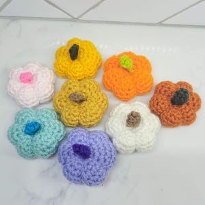 Crochet Mini Pumpkins in various colors.