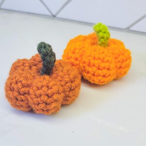Crochet Mini Pumpkins in various colors.