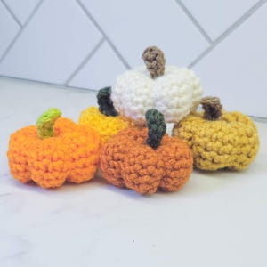 Crochet Mini Pumpkins in various colors.