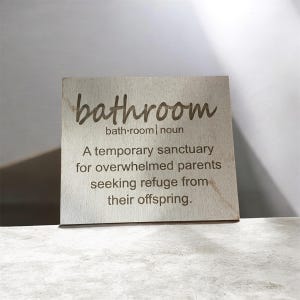 Bathroom: a temporary sanctuary for overwhelmed parents seeking refuge from their offspring - sign