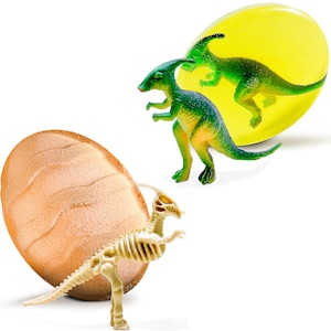 May include: A set of three dinosaur toys, including a green dinosaur inside a yellow egg, a green dinosaur standing on a white surface, and a beige skeleton dinosaur standing on a brown egg.