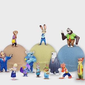 May include: A set of 12 Zootopia character figurines, including Judy Hopps, Nick Wilde, Flash, and more. The figurines are standing on colorful bath bombs.