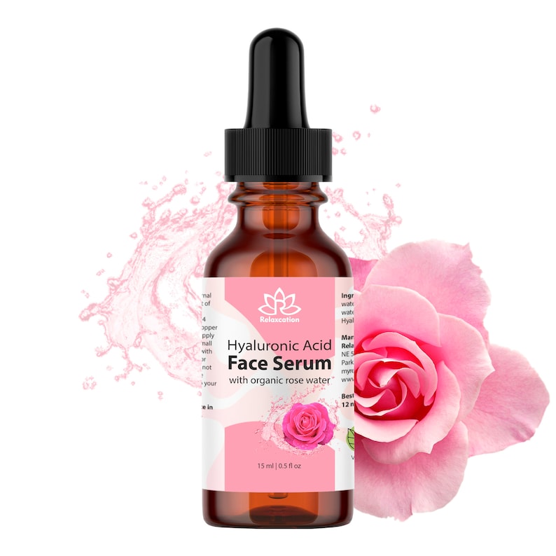 May include: A brown glass bottle with a black dropper top containing Hyaluronic Acid Face Serum with organic rose water. The bottle is labeled "Relaxcation" and has a pink rose on the label. The bottle is surrounded by water droplets.