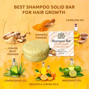 May include: A yellow shampoo bar with the text "Relaxcation Shampoo Bar Ginger Root Camelina Oil Zero Waste Handcrafted in USA 75g 12.5oz" on the label. The bar is surrounded by ingredients including ginger root powder, turmeric powder, camilina oil, lemongrass oil, orange and lemon oils, and bergamot oil.