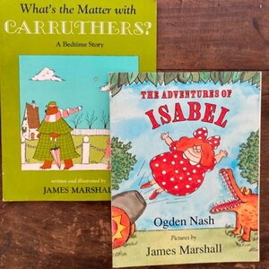 May include: Two children's books with green and blue covers. The book on the left is titled "What's the Matter with CARRUTHERS? A Bedtime Story" and is illustrated with a man in a green and white striped shirt and a blue hat. The book on the right is titled "THE ADVENTURES OF ISABEL" and is illustrated with a girl in a red and white polka dot dress flying through the air. The text on the cover reads "Ogden Nash" and "Pictures by James Marshall."