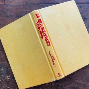 May include: A yellow book with a red spine titled "The Milly-Molly-Mandy Story Book" by Joyce Lankester Brisley. The book is published by Kingfisher.