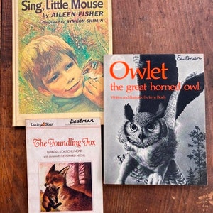 May include: Three children's books with colorful covers. The top book is titled "Sing, Little Mouse" by Aileen Fisher. The middle book is titled "The Foundling Fox" by Irina Korschunow. The bottom book is titled "Owlet, the great horned owl" by Irene Brady.