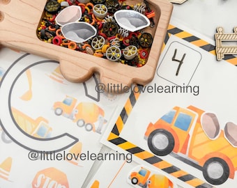 May include: A printable worksheet for children featuring a yellow cement mixer truck with the number 4. The worksheet includes a stop sign, a traffic cone, and a space for the child to count and match the number of trucks.