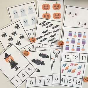 May include: A set of 10 Halloween-themed counting cards featuring various images such as ghosts, bats, cats, pumpkins, witches, and sweets. Each card has a number and a corresponding number of images.