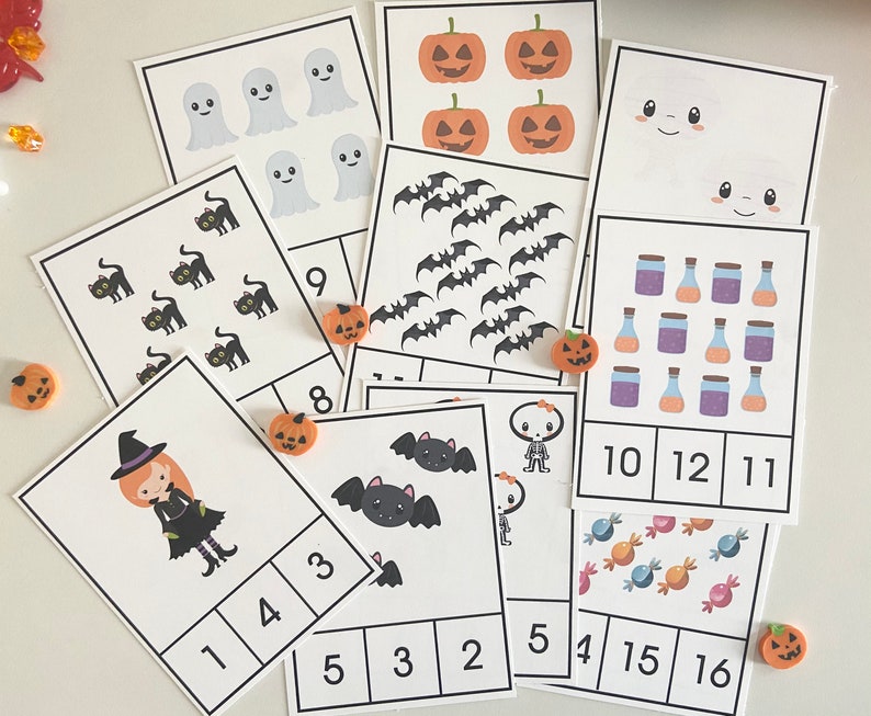 May include: A set of 10 Halloween-themed counting cards featuring various images such as ghosts, bats, cats, pumpkins, witches, and sweets. Each card has a number and a corresponding number of images.