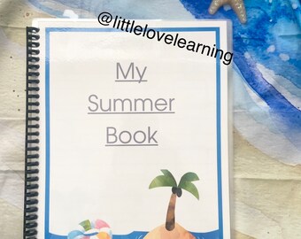May include: A white spiral bound book with a blue border. The cover has the text "My Summer Book" and a cartoon image of a palm tree on an island with a life ring floating in the water. The text "@littlelovelearning" appears at the top and bottom of the cover.