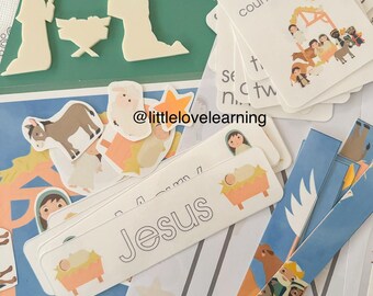 May include: A set of printable Christmas nativity scene activity cards for children. The cards feature a manger scene with the baby Jesus, Mary, Joseph, and animals. The cards are designed to be used for counting and learning about the nativity story. The cards are printed on white cardstock and have a colourful design.