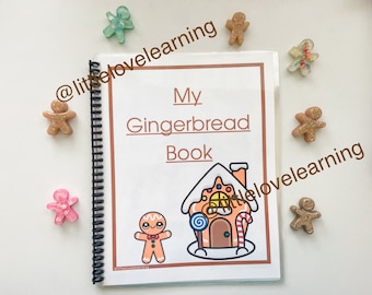 May include: A brown spiral bound book with the title "My Gingerbread Book" on the cover. The cover also features a cartoon gingerbread house with candy decorations and a gingerbread person.