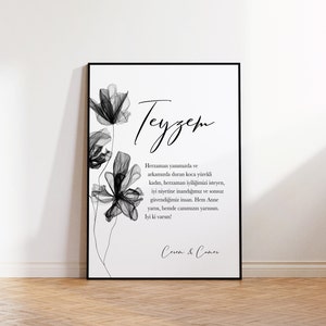 May include: Black and white printable art print with a floral design and the text "Teyzem" which translates to "Aunt" in English. The text below reads "Herzaman yanımızda ve arkamızda duran koca y&uuml;rekli kadın, herzaman iyiliğimizi isteyen, iyi niyetine inandığımız ve sonsuz g&uuml;vendiğimiz insan. Hem Anne yarısı, hemde canımızın yarısısın. Iyi ki varsın!" which translates to "Always by our side and behind us, a big-hearted woman, always wanting our good, someone we believe in and trust infinitely. Both a mother figure and a part of our soul. Glad you are here!" The print is signed "Ceren & Coner".