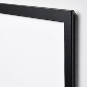 May include: A black picture frame with a white mat. The frame is made of wood and has a simple, modern design.