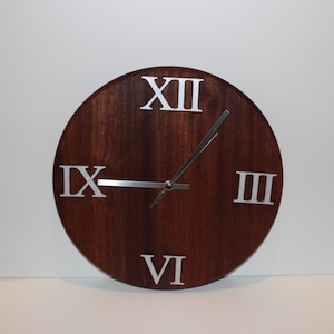 handcrafted, round Sapele (hardwood) wall clock