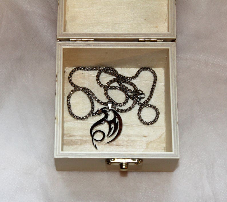 Small wooden trinket box with a pyrographed dragon design