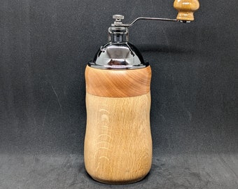 Manual coffee grinder with a lathe turned Goncalo Alves and Oak wood body