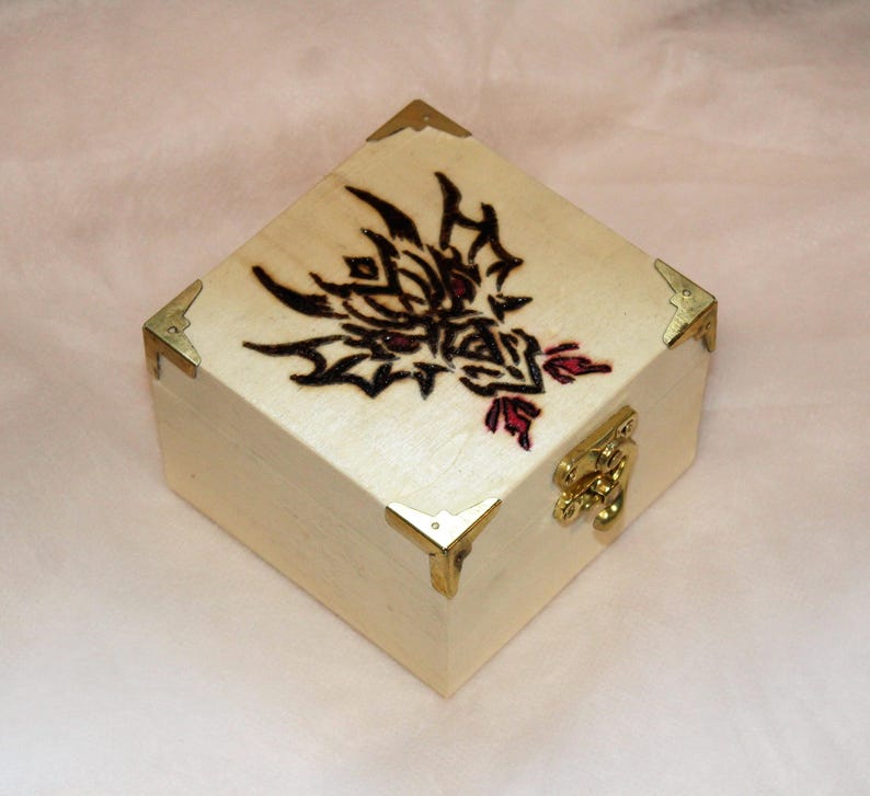 Small wooden trinket box with a pyrographed dragon design