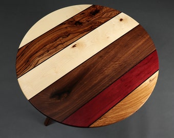 round coffee table "Sabella" made of colorful precious woods and decorative stripes in elegant design