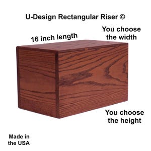 May include: A rectangular wooden riser with a reddish-brown finish. The product is 16 inches in length, with customizable width and height options. The text "U-Design Rectangular Riser" is visible. The product is made in the USA.
