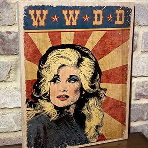 What would Dolly do) sign on wood.
