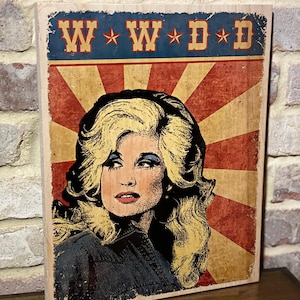 What would Dolly do) sign on wood.