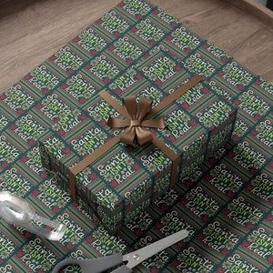 ラッピングペーパー サンタは実在しないラッピングペーパー 面白いクリスマスギフトラッピング 失礼なラッピングペーパー 陽気なギフトラッピング 大人用ラッピングペーパーロール