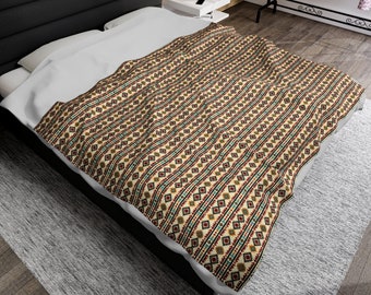 May include: A beige and brown patterned duvet cover with geometric designs in red, blue, and green. The duvet cover is on a bed with a white sheet and a black headboard.