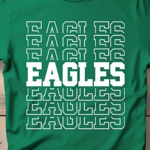 May include: Green t-shirt with a white graphic of the word "EAGLES" repeated in a stacked, retro design.