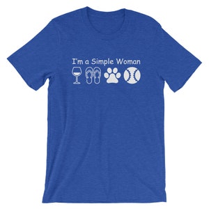 May include: A royal blue t-shirt with the text "I'm a Simple Woman" and white icons of a wine glass, flip flops, a paw print, and a baseball.
