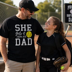 She Gets It From Her Dad Softball Shirt | Softball Dad Gift | Fastpitch Dad Shirt | Softball Family Tee | Father's Day Gift | Gildan 64000