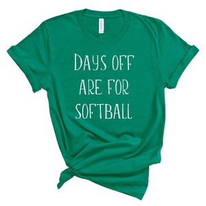 May include: A green t-shirt with the text "Days off are for softball" in white.
