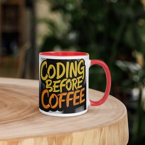 May include: White ceramic mug with a red rim and handle. The mug has a black background with the text "Coding Before Coffee" in yellow and orange lettering.