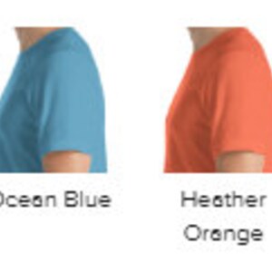 May include: A side view of a t-shirt in ten different colors: black, heather midnight navy, kelly green, ocean blue, heather orange, heather true royal, red, heather raspberry.