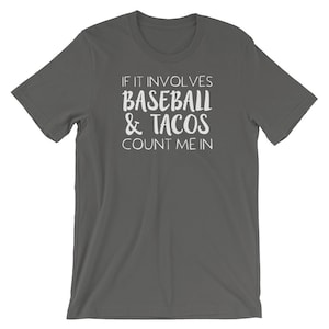 May include: A dark gray t-shirt with white text that reads "If it involves baseball & tacos count me in."
