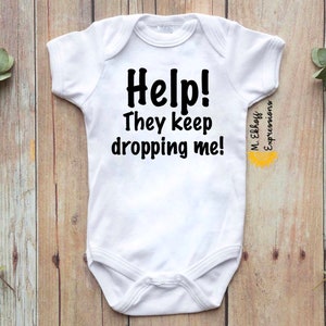 Help they keep dropping me funny baby body suit bodysuit one piece kids infant toddler newborn babe baby shower gift new mom new parents