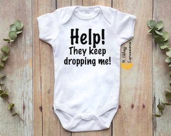 Help they keep dropping me funny baby body suit bodysuit one piece kids infant toddler newborn babe baby shower gift new mom new parents