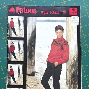 May include: A vintage knitting pattern cover showing a woman in a red sweater with black detailing and black trousers. The cover displays the text "Patons 8 ply totem" and a price code.