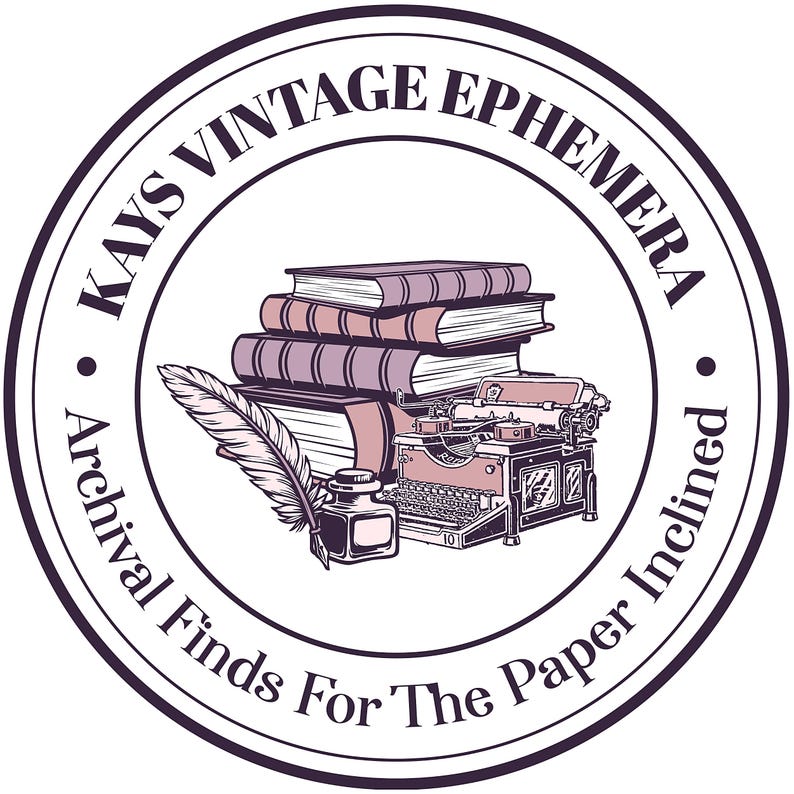 May include: A circular logo featuring a stack of three books, a vintage typewriter, and an inkwell with a quill pen. The text KAYS VINTAGE EPHEMERA and Archival Finds For The Paper Inclined is printed in a dark purple font along the circular border.