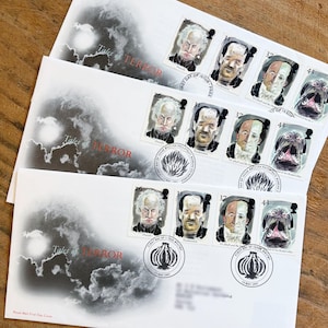 May include: Three first day cover envelopes featuring stamps with portraits of characters from the "Tales of Terror" series. The envelopes have a cloudy sky design and the text "Tales of Terror". The stamps depict Dracula, Frankenstein, Dr. Jekyll, and the Hound of the Baskervilles.