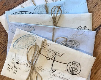 19th Century French handwritten invoices or receipts, 5 antique letterheads from France, postmarked and folded, tied with string for display