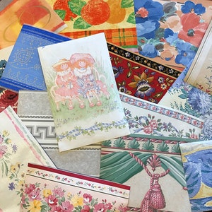 May include: A selection of vintage wallpaper samples showcasing diverse patterns and designs. The samples include floral, geometric, and scenic motifs in various colours, such as pink, blue, and orange. One sample depicts two girls seated on a bench.