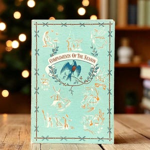 Livre King Penguin vintage Compliments Of The Season, 16 planches en couleur magnifiquement illustrées, cadeau de remplissage de bas de Noël pour collectionneur