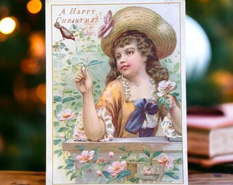 Carte de Noël victorienne ancienne représentant une jeune fille et un joli petit oiseau entourés de roses roses, une belle chromolithographie de Noël vintage